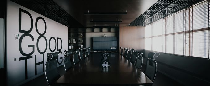 A darkened boardroom